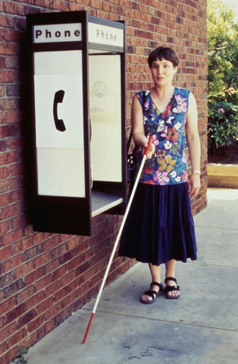 Visually-impaired woman using the cane