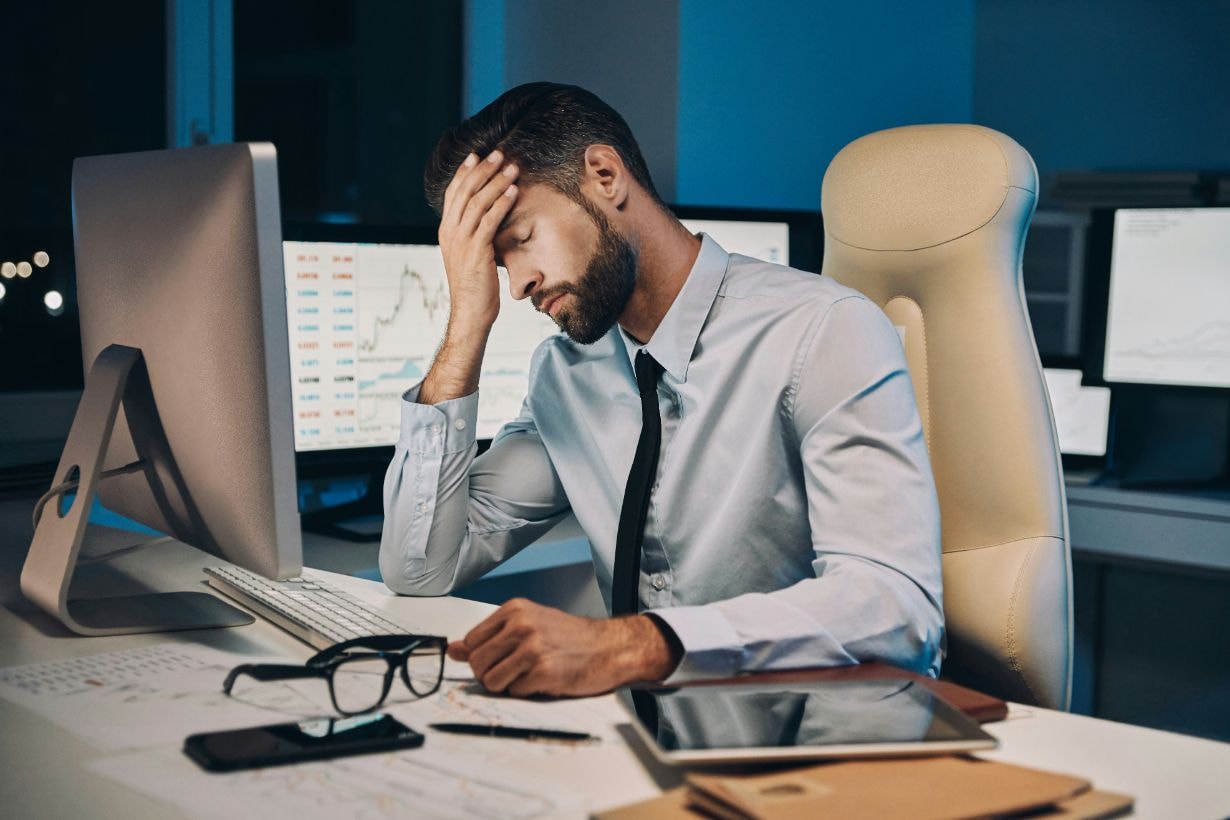 Male employee stressed out at his office