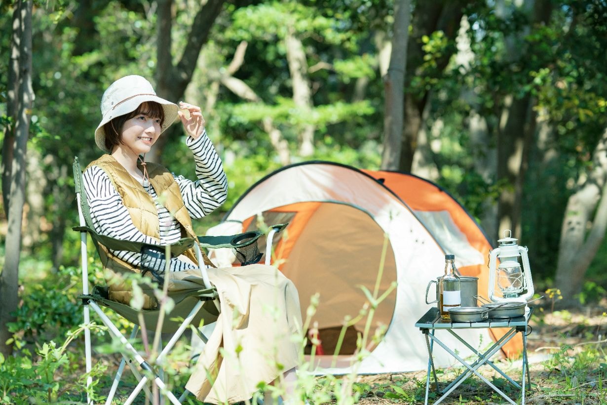 Asian carer enjoying her camping vacation